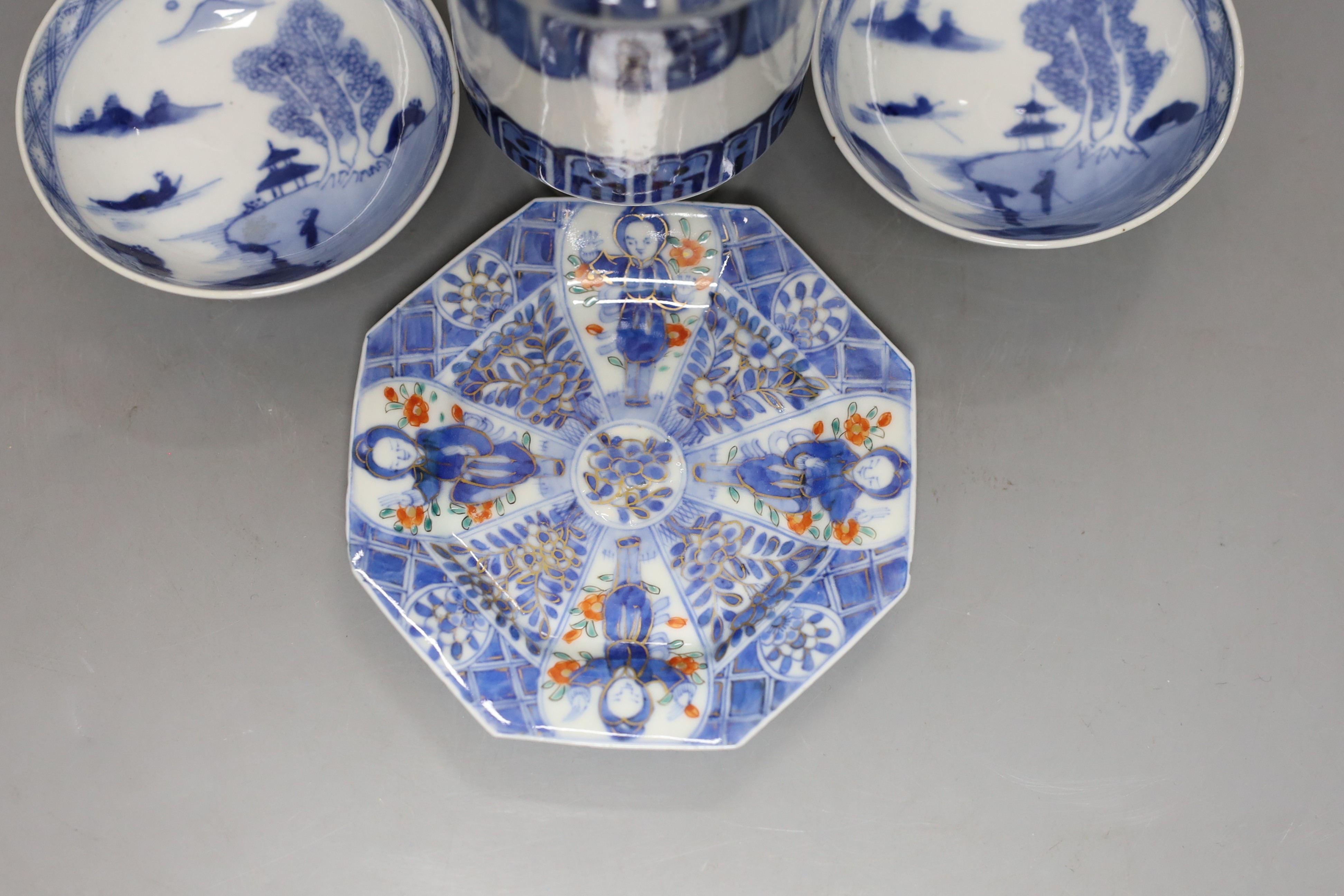 A Japanese blue and white vase, two similar dishes and a tea bowl and saucer